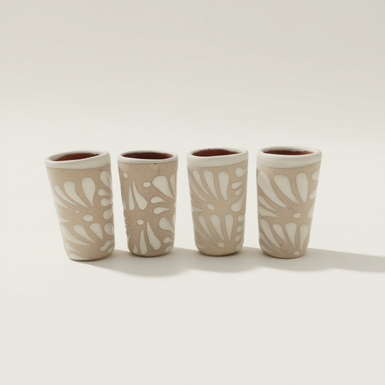 Cream Talavera Shot Glass | Handcrafted Mexican Ceramic, set of four cream-toned hand-painted Talavera shot glasses with white floral relief patterns, kiln-fired