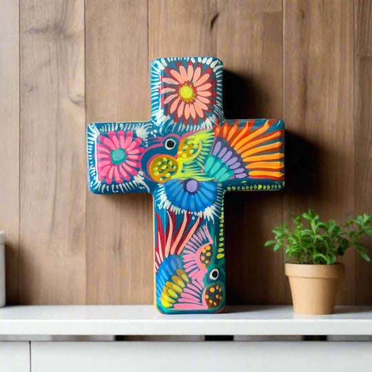 Guerrero Hand-Painted Cross Wall Art | Colorful Mexican Décor — vibrant hand-painted Guerrero cross with floral folk-art on shelf