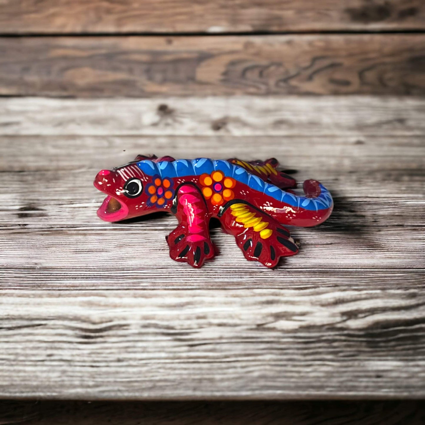 Guerrero Iguana Figurine | Colorful Hand-Painted Mexican Folk Art - hand-painted red and blue Guerrero iguana on wooden table