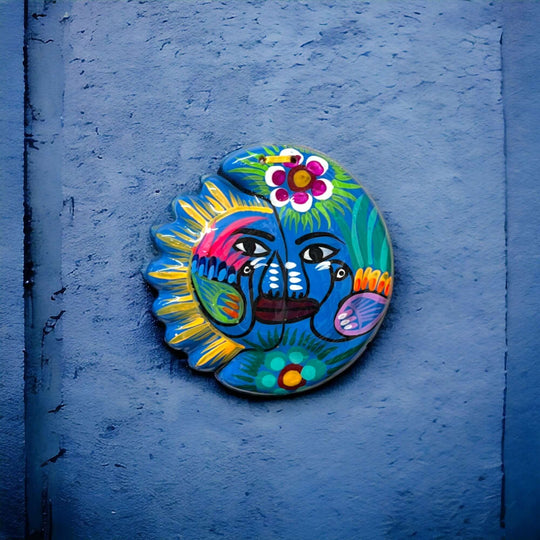 Guerrero Sun Moon Wall Art | Hand-Painted Mexican Eclipse Decor - hand-painted Talavera sun-moon with florals and tropical bird on black background