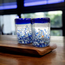 Hand Blown Mexican Shot Glass | Blue and White Artisan Tequila Shooter - pair of hand-blown blue and white swirl tequila shot glasses on wooden board