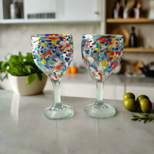 Mexican Confetti Rock Wine Glass | Hand-Blown Confetti Design - pair of hand-blown colorful confetti wine glasses on kitchen countertop