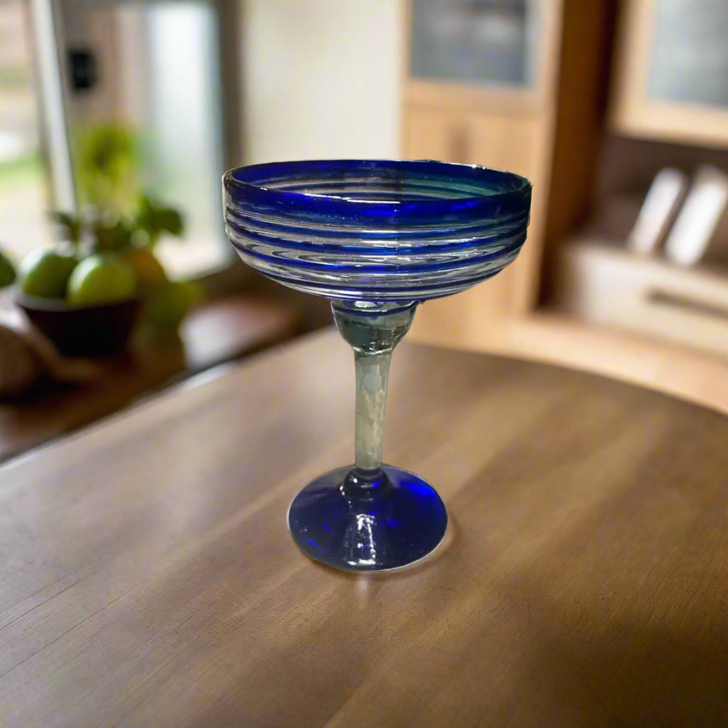 Mexican Margarita Glass | Hand-Blown Blue Swirl Cocktail Cup on wooden table, cobalt blue swirl hand-blown lead-free glass margarita cup