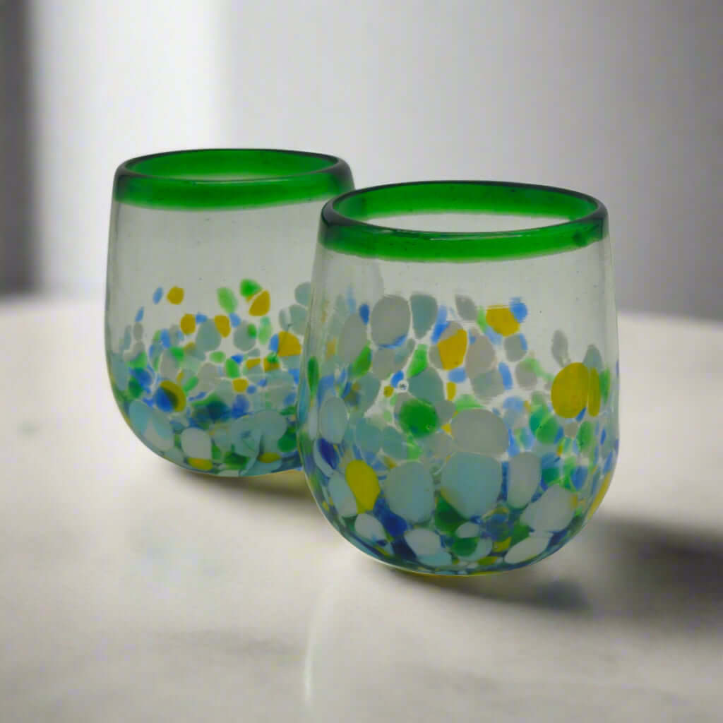 Hand-Blown Stemless Wine Glass | Mexican Confetti with Green Rim - pair of hand-blown lead-free glasses with blue, yellow, white confetti and bold green rim