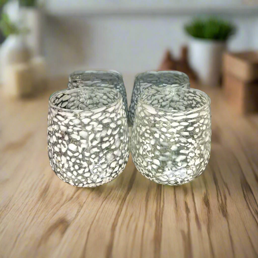 White Pebbled Wine Glass | Hand-Blown Mexican Stemless Glassware – set of four frosted, hand-blown lead-free glasses with white pebble pattern on wood table