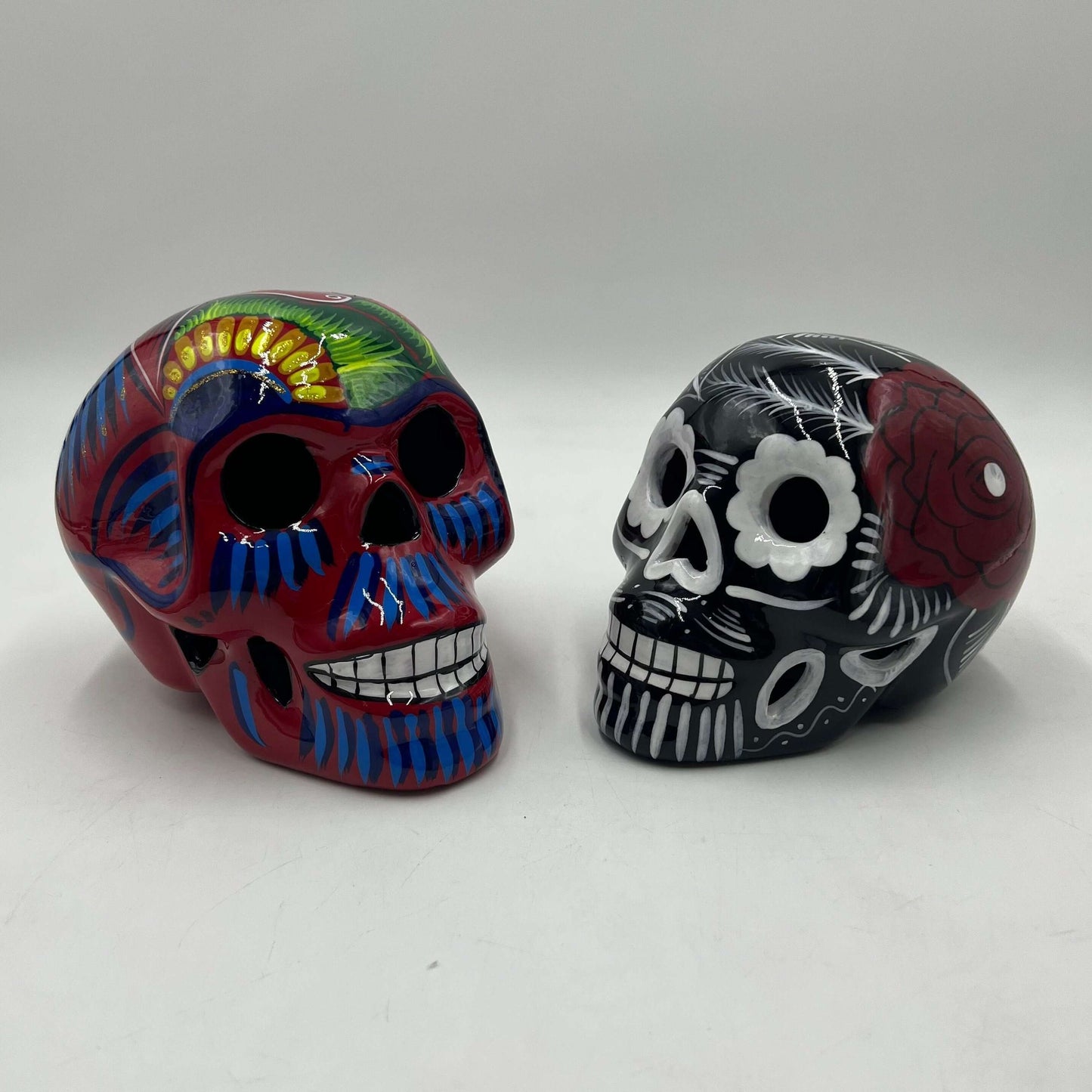 Guerrero Calavera Skull | Large Hand-Painted Day of the Dead Art - two colorful hand-painted Guerrero pottery skulls from Guanajuato
