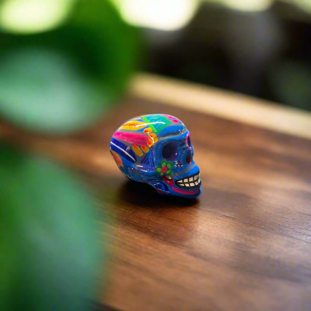 Hand-Painted Guerrero Skull | Colorful Mexican Artisan Statue - vibrant hand-painted Guerrero pottery skull on wooden surface