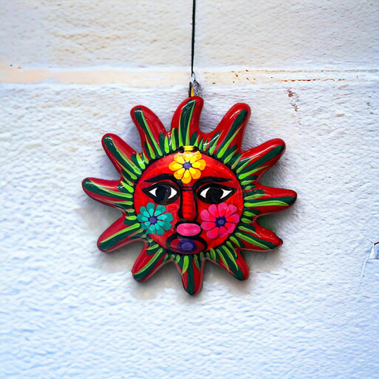 Hand-Painted Guerrero Sun Wall Art | Mexican Folk Decor hanging red sun with floral face, bold blues and radiant reds, handcrafted in Guanajuato, Mexico