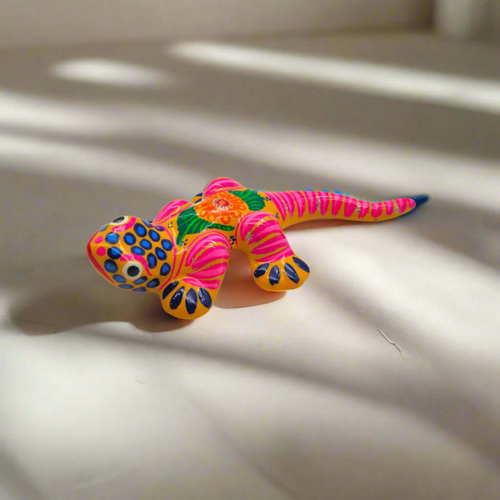 Vibrant Guerrero Gecko Figurine | Hand-Painted Mexican Folk Art - hand-painted pink & green striped Guerrero gecko with floral motif