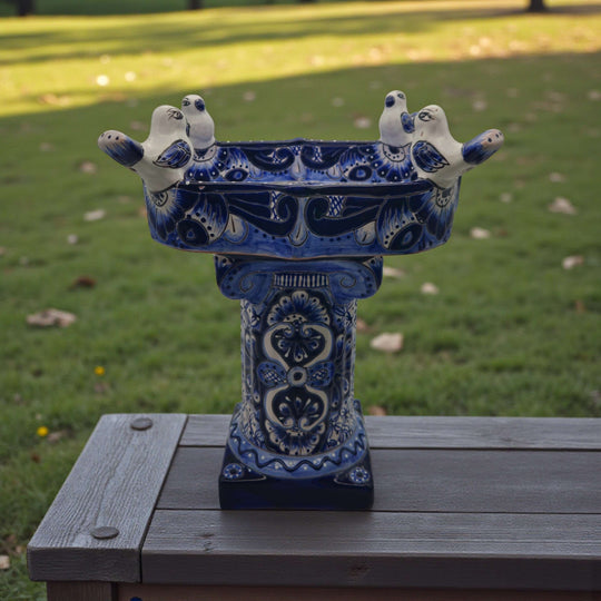 Colorful Talavera Bird Bath | Hand-Painted Ceramic Garden Art - blue hand-painted Talavera bird bath with perched ceramic birds on pedestal in garden