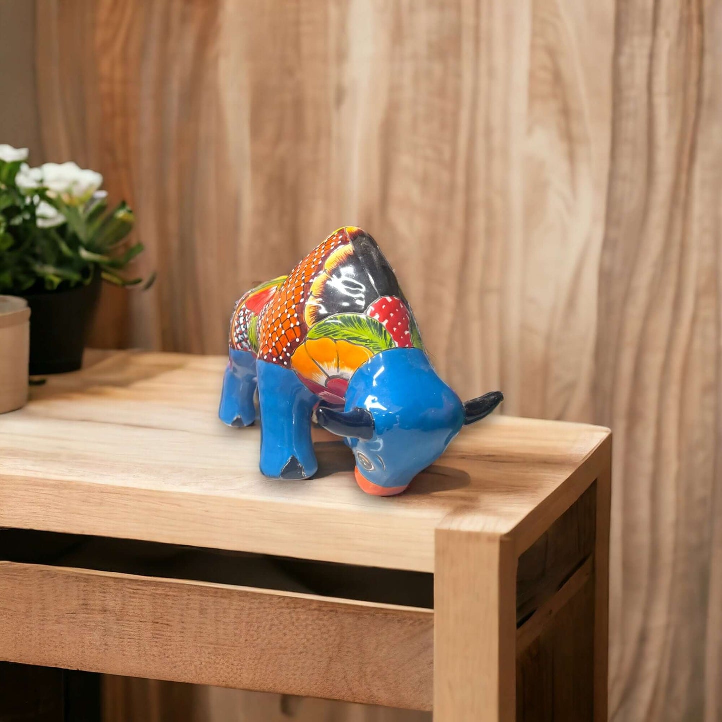 Talavera Bull Statue | Hand-Painted Mexican Ceramic Animal Decor - hand-painted blue floral talavera bull on wooden table