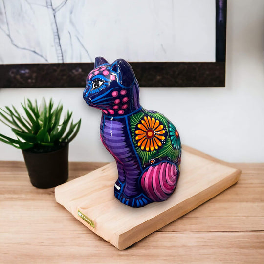 Talavera Cat Piggy Bank | Hand-Painted Mexican Ceramic Coin Holder - hand-painted purple floral ceramic cat on wooden stand