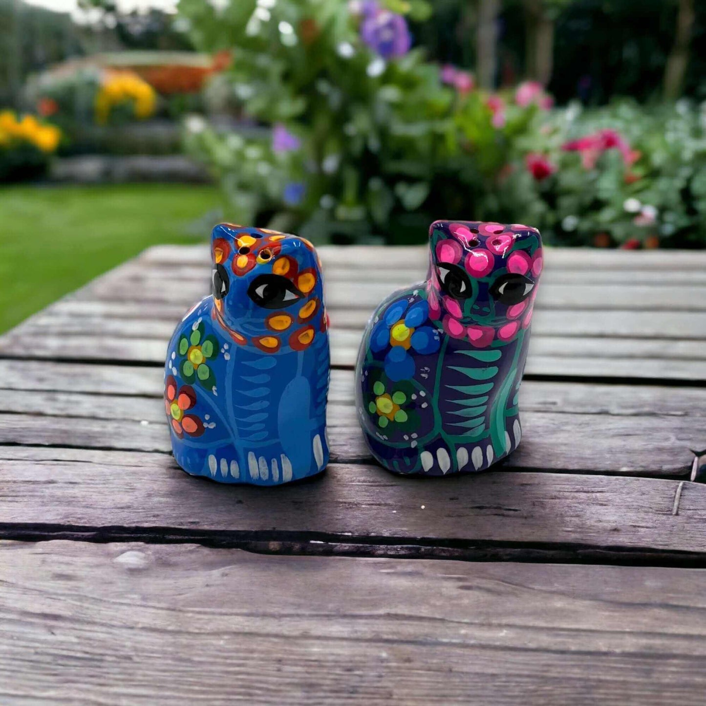 Set of 2 Talavera Cat Salt and Pepper Shakers | Hand-Painted Ceramic - hand-painted blue and pink ceramic cat shakers on outdoor wooden table