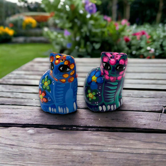 Set of 2 Talavera Cat Salt and Pepper Shakers | Hand-Painted Ceramic - hand-painted blue and pink ceramic cat shakers on outdoor wooden table