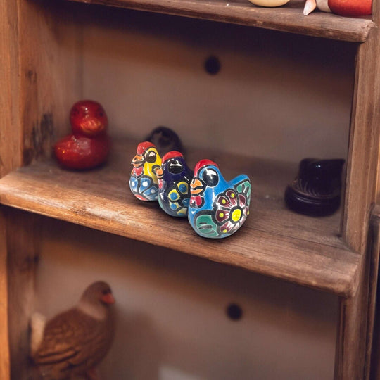 Set of 2 Hand-Painted Talavera Chicken Figurines | Mexican Ceramic Chickens - hand-painted colorful Talavera ceramic chickens on wooden shelf