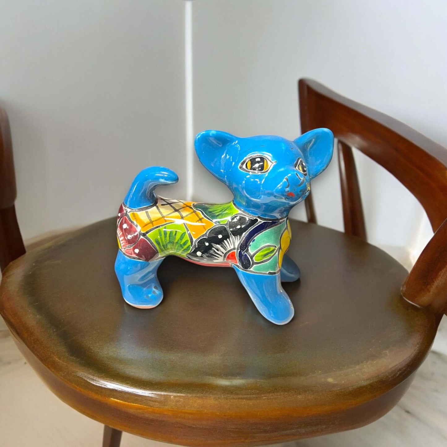 Hand-Painted Talavera Chihuahua Statue | Mexican Ceramic Animal Decor (Medium) - bright blue hand-painted Talavera ceramic Chihuahua on wooden chair