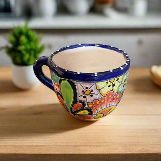 Talavera Coffee Mug | Hand-Painted Mexican Ceramic Cup showcasing colorful hand-painted flowers, cobalt blue rim, handcrafted in Guanajuato, Mexico