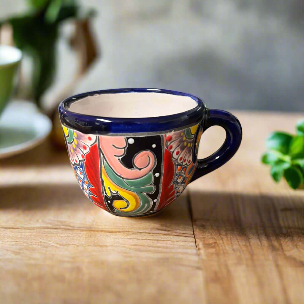 Talavera Coffee Mug | Hand-Painted Mexican Ceramic Cup showing colorful hand-painted floral Talavera patterns with cobalt blue rim