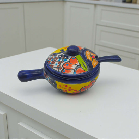 Talavera Salsa Bowl with Lid | Hand-Painted Ceramic Salsera - hand-painted multicolor floral covered salsera with deep blue trim on white counter