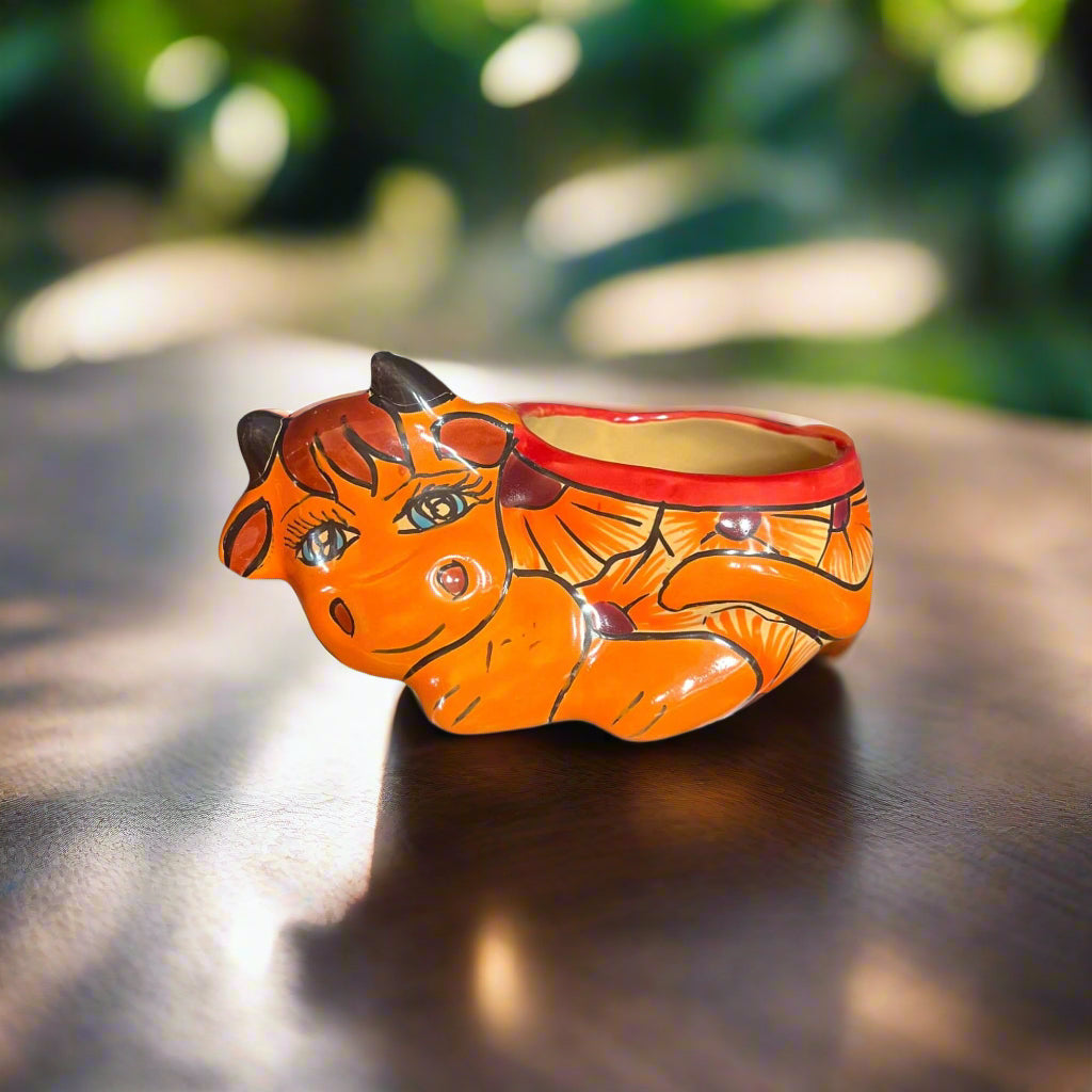 Talavera Cow Planter | Hand-Painted Mexican Ceramic Animal Pot - vibrant hand-painted orange cow planter with floral and geometric Talavera design
