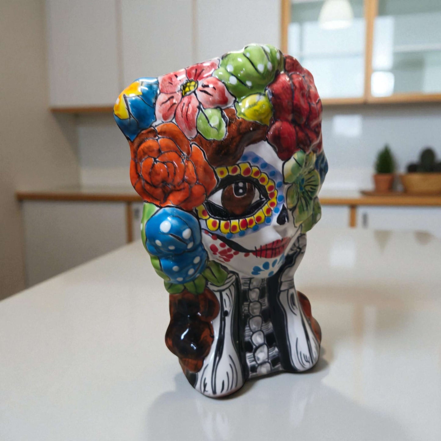 Colorful Talavera Skull Planter | Hand-Painted Ceramic Pot - hand-painted Day of the Dead skull planter with vivid red green blue yellow floral motifs