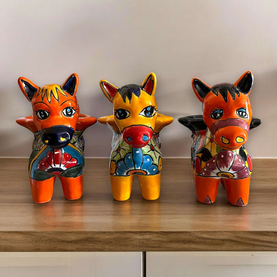 Talavera Donkey Planter | Hand-Painted Mexican Burro Flower Pot - trio of hand-painted floral Talavera donkey planters on wooden shelf