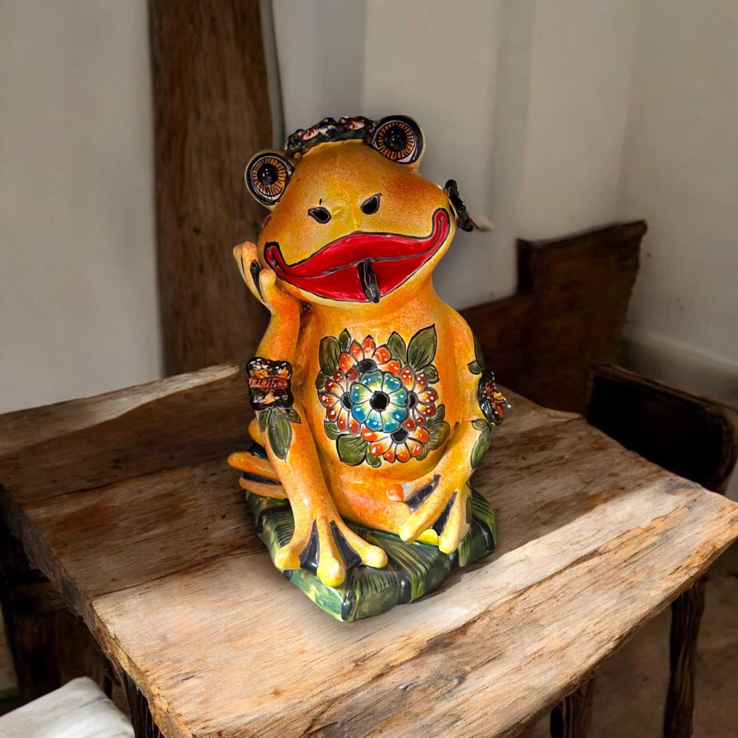 Hand-Painted Talavera Frog Statue | Mexican Ceramic Animal Decor — hand-painted black-glazed frog with colorful floral details on wooden table
