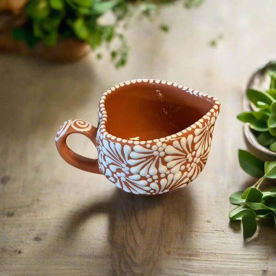 Talavera Heart Mug | Hand-Painted Mexican Coffee Cup — hand-painted terracotta heart-shaped mug with white floral Talavera pattern