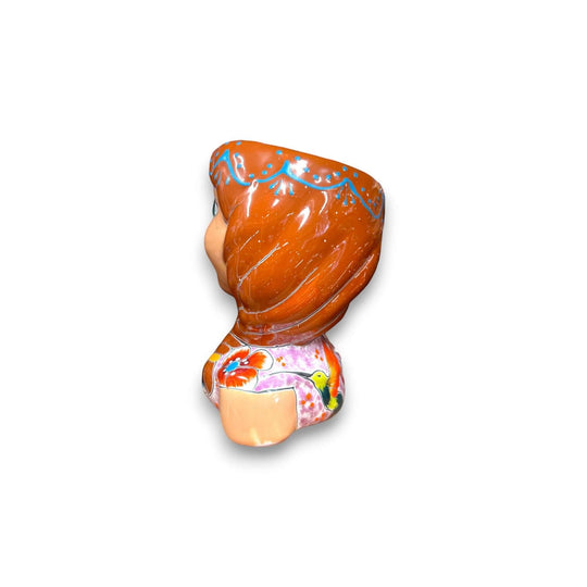Hand-Painted Talavera Ceramic Lady Planter | Mexican Artwork Décor - rear view of hand-painted Talavera lady planter with braided hair and floral glaze