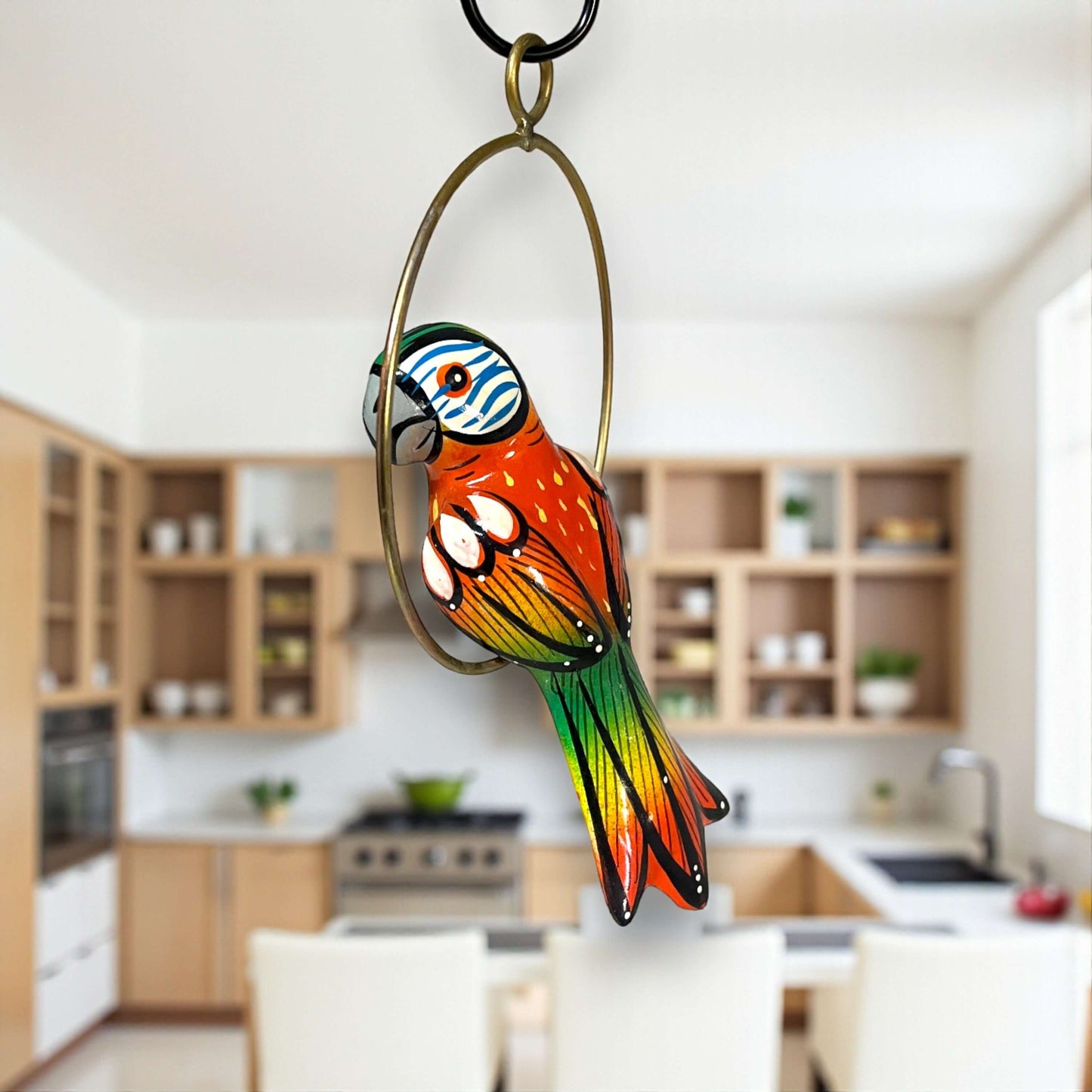 Vibrant Mini Talavera Parrot | Hand-Painted Hanging Accent — hand-painted Talavera parrot on brass-toned ring, vivid blues reds yellows, kiln-fired lead-free glaze