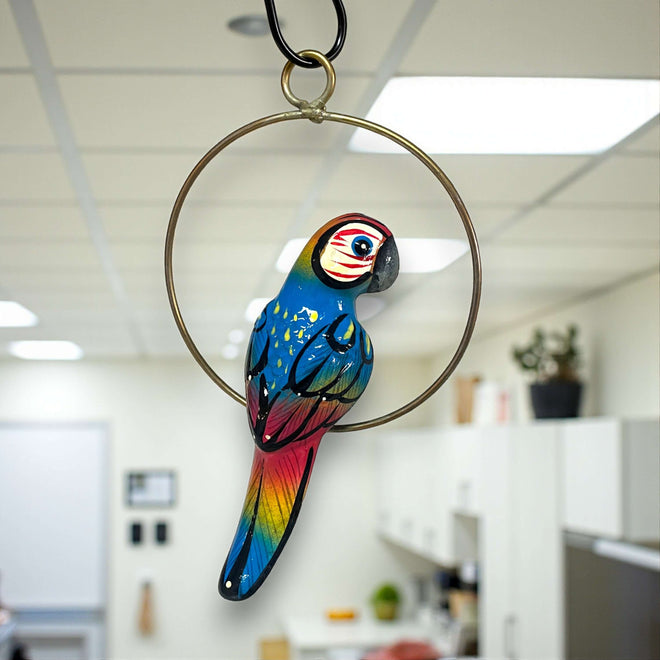 Vibrant Mini Talavera Parrot | Hand-Painted Hanging Accent — hand-painted blue red yellow parrot on brass-toned ring, artisan Talavera charm