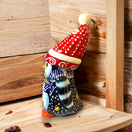 Hand-Painted Talavera Penguin Statue | Festive Christmas Decor (Medium) - hand-painted Talavera penguin with red polka-dot hat on wooden shelf