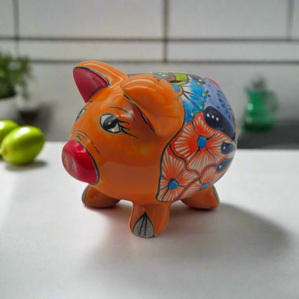 Hand-Painted Talavera Piggy Bank | Mexican Folk Art Design — hand-painted orange Talavera ceramic piggy bank with floral and geometric patterns