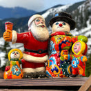 Talavera Santa & Snowman Statue | Hand-Painted Christmas Decor - hand-painted Talavera Santa and snowman set with colorful floral patterns, kiln-fired lead-free glaze