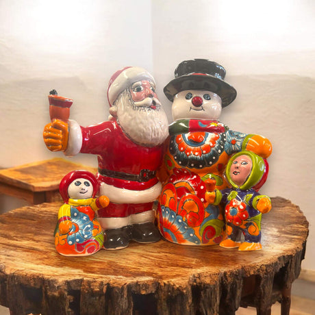 Talavera Santa & Snowman Statue | Hand-Painted Christmas Decor - vibrant hand-painted Talavera Santa and snowman family on wooden table
