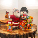 Talavera Santa & Snowman Statue | Hand-Painted Christmas Decor - vibrant hand-painted Talavera Santa and snowman family on wooden table