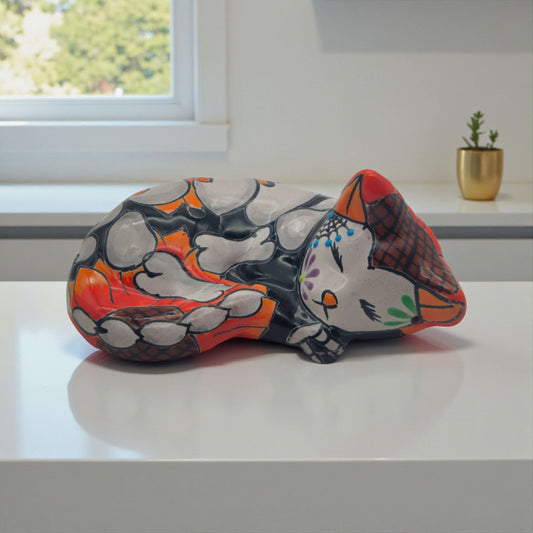 Talavera Sleeping Cat Figurine | Hand-Painted Mexican Decor - hand-painted colorful sleeping cat with floral & geometric motifs on dark base