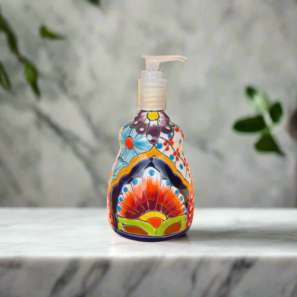 Talavera Soap Dispenser | Hand-Painted Mexican Ceramic Bathroom Decor - hand-painted multicolor Talavera ceramic pump on marble counter