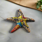 Talavera Starfish Decor | Hand-Painted Mexican Wall Art - hand-painted five-point Talavera starfish with bold blue red orange floral and geometric patterns