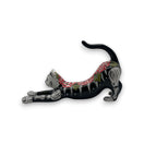 Talavera Stretching Cat Figurine | Hand-Painted Calavera Art - black hand-painted Talavera cat stretching with red floral and white skeletal accents