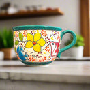 Talavera Tea Cup Planter | Hand-Painted Mexican Ceramic Pot showing colorful hand-painted floral and bird design on ceramic cup planter