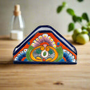 Talavera Napkin Holder | Hand-Painted Mexican Ceramic Decor - hand-painted triangular Talavera napkin holder with cobalt rim and vivid floral pattern