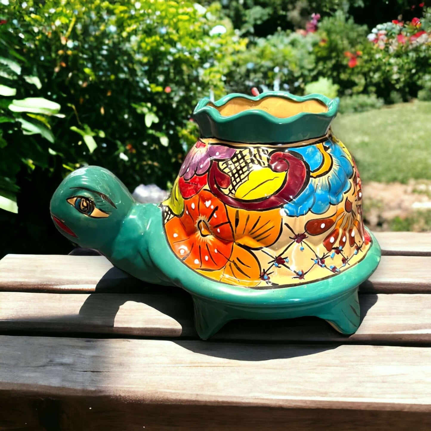 Vibrant Talavera Turtle Planter | Colorful Hand-Painted Mexican Pottery (Medium) on wooden bench, bright floral hand-painted ceramic turtle planter