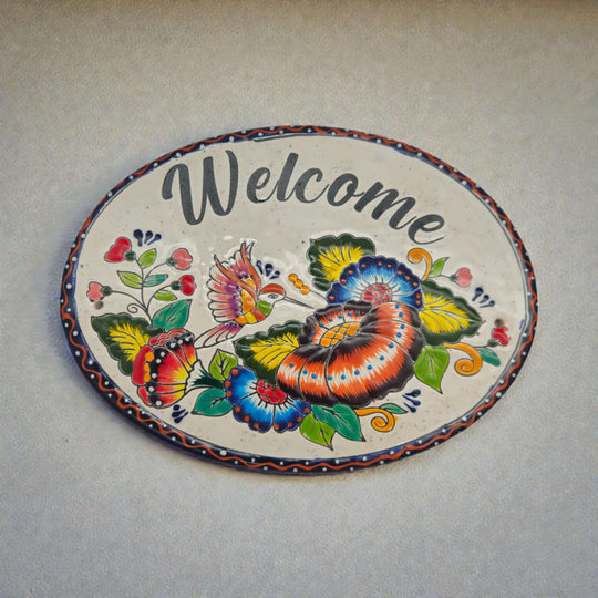 Colorful Talavera Welcome Plaque | Hand-Painted Wall Sign - oval hand-painted Talavera ceramic with vivid floral motif and hummingbird