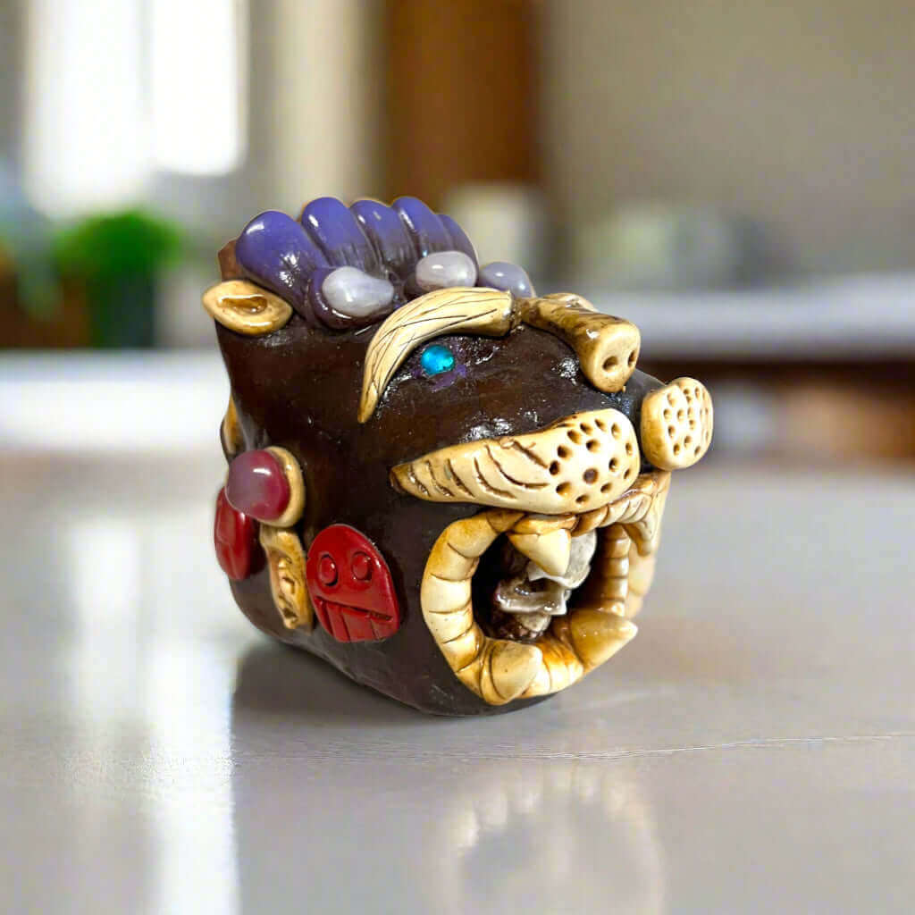 Aztec Death Whistle | Handcrafted Mexican Cultural Instrument - handcrafted fierce creature head with carved details and turquoise eye, Guanajuato workshop