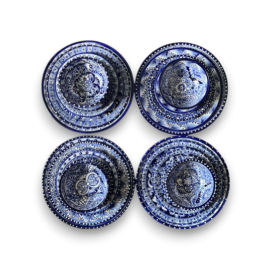 30-Piece Talavera Dinnerware Set | Blue & White Tableware for 6 - overhead view of four hand-painted blue and white Talavera plates and bowls