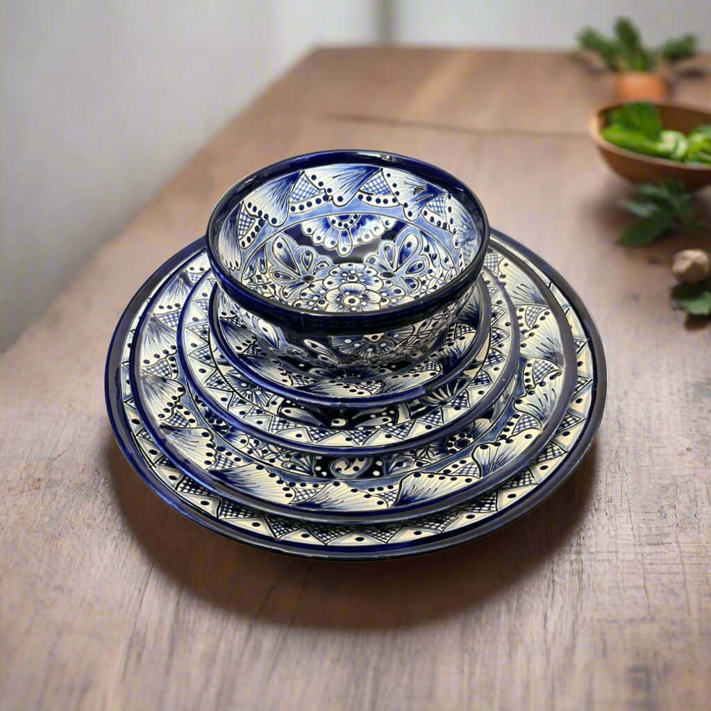 30-Piece Talavera Dinnerware Set | Blue & White Tableware for 6 - handcrafted blue and white Talavera plates and bowls stacked on wooden table