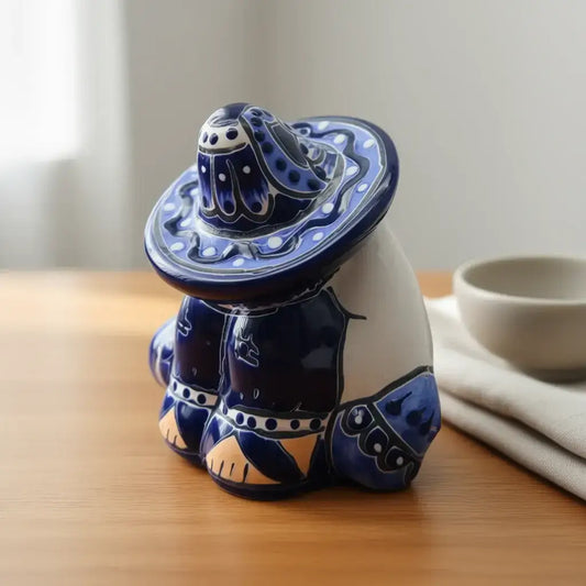 Handcrafted Talavera Panchito Figurine | Blue & White Pottery - hand-painted blue & white sleeping man pottery accent