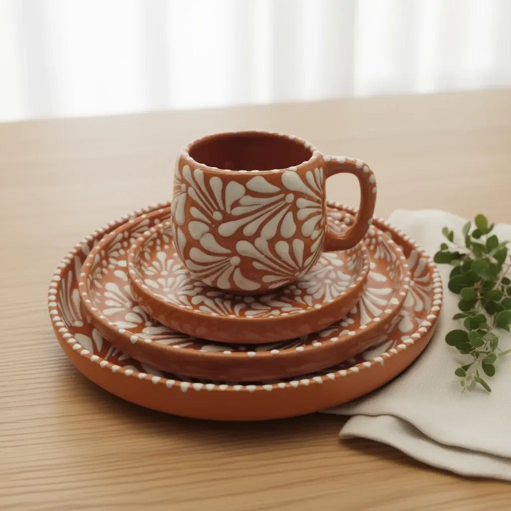 Handcrafted Talavera Dinnerware Set | Brown & White 4-Piece - rustic brown cup and stacked plates with white floral patterns on wooden table