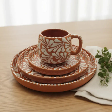 Handcrafted Talavera Dinnerware Set | Brown & White 4-Piece - rustic brown cup and stacked plates with white floral patterns on wooden table